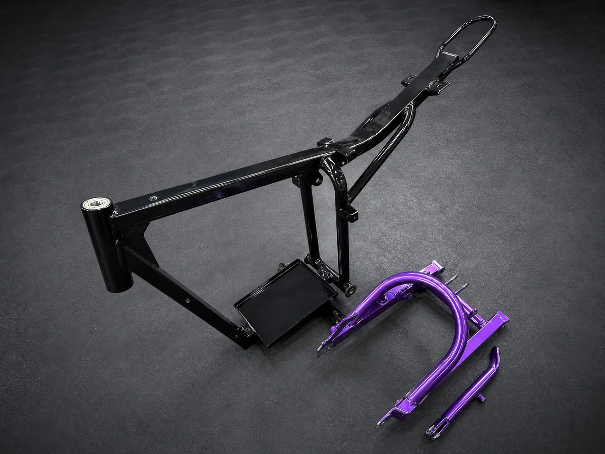 Gloss-black motorcycle frame with purple coated parts