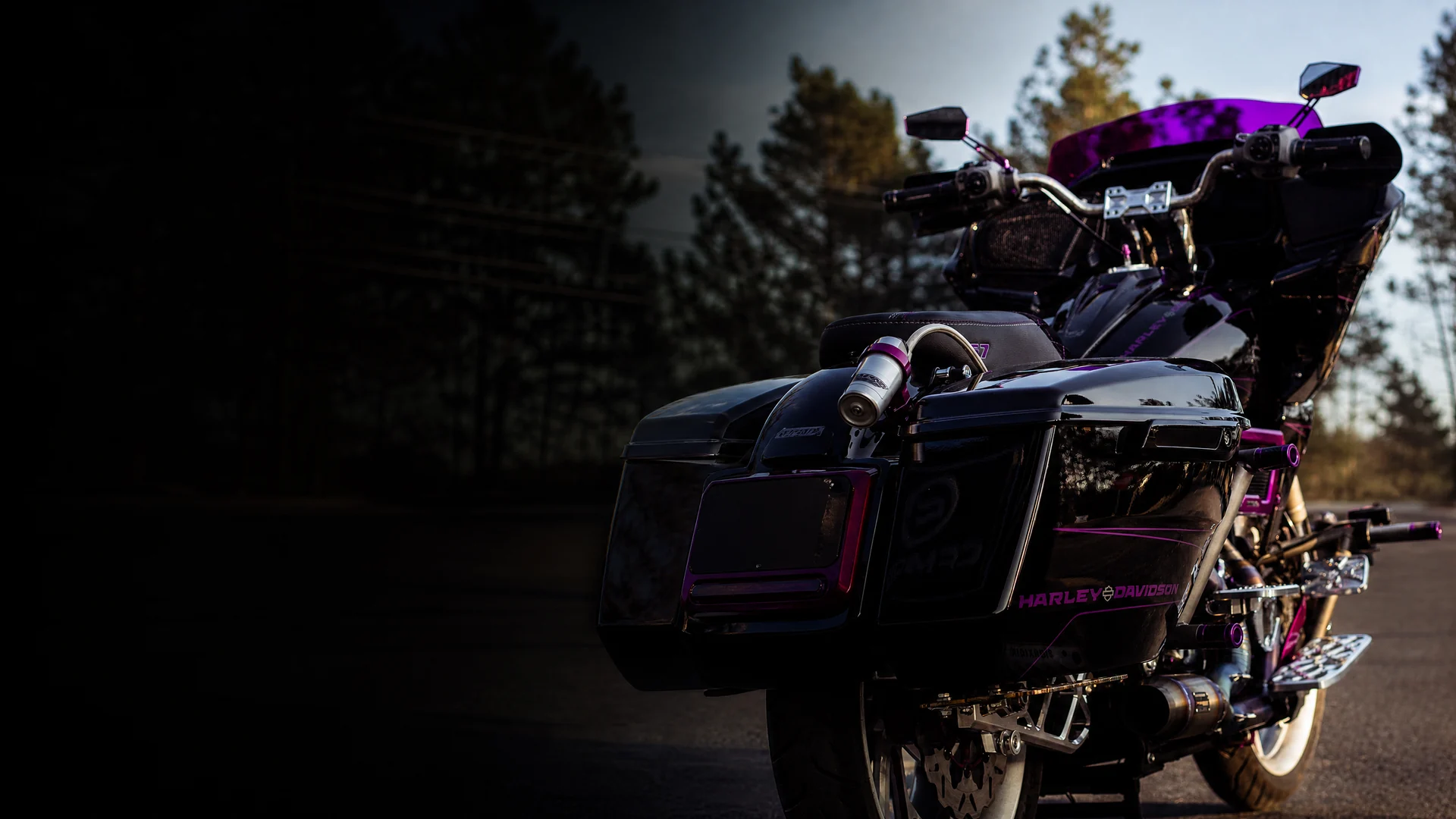 Custom black motorcycle with magenta coated details